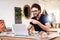 Freelancer bearded man drinking tea at laptop sitting at desk.