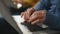 Freelancer hands typing keyboard holding laptop closeup. Unknown man working