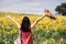 Freeom woman in beauty field with sunflowers