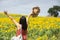 Freeom woman in beauty field with sunflowers