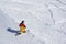 Freeride snowboarder kicks off the track,