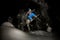 Freerider rides at night on powder snow blows up