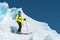 A freerider skier in complete outfit stands on a glacier in the North Caucasus