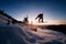 freerider skilfully making jump over snow-covered slope on snowboard against beautiful clear sky.