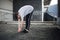 Freerunner Stretching on a Rooftop