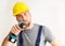freestanding craftsman construction worker assembler with drilling machine - friendly worker in work clothes on white background