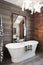 Freestanding vintage style bath tub in renovated warehouse apart