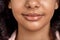 Freestyle. African girl standing isolated on pink smiling happy lips close-up