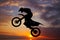 Freestyle motocross at sunset