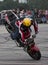 Freestyle motorcycle shows with front wheel riding