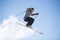 Freestyle ski jumper with crossed skis