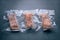 Freeze cooked salmon in vacuum packs on grunge table