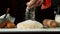 Freeze motion of cooker hand pouring flour