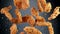 Freeze motion of flying pieces of fried chicken pieces