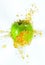 Freeze motion of sliced green apple with splashing juice.