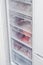 The freezer filled with multi-colored useful products and vitamins for the winter