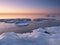 Freezing sea shore in the romantic evening light