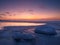 Freezing sea shore in the romantic evening light