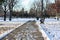 Freezing walkway in winter covering with snow and ice.