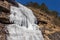 Freezing waterfall that flew from the mountain at Lachen. North Sikkim, India