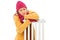 Freezing young woman leaning on a radiator