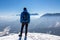 Freiberg - Man enjoying panoramic view from summit Freiberg of Karawanks, Julian Alps, in Carinthia, Austria. Snow shoe