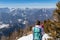 Freiberg - Woman enjoying panoramic view from summit Freiberg of Karawanks, Julian Alps, in Carinthia, Austria. Snow shoe