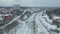 Freight Cargo Train Going through winter forest in the suburbs , a bird's-eye view from a drone.