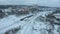 Freight Cargo Train Going through winter forest in the suburbs , a bird's-eye view from a drone.