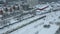 Freight Cargo Train Going through winter forest in the suburbs , a bird's-eye view from a drone.