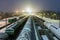 Freight cars on the sorting cargo station in the light of searchlights