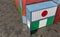 Freight containers with Nigeria and Japan flags.