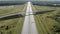 Freight and passenger vehicles moving along the highway. Aerial photography