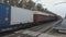 Freight rail transport passes by the camera