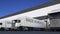 Freight semi trucks with MADE IN MEXICO caption on the trailer loading or unloading. Road cargo transportation 3D