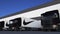 Freight semi trucks with Nike inscription and logo loading or unloading at warehouse dock, seamless loop. Editorial