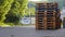 Freight Shipping Transport Standard Wooden Euro Pallets Stacked By Loading Dock Ramp of Store Building