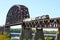 Freight Train Crossing a Steel Railroad Truss River Bridge