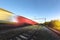 Freight train in motion with blur effect at sunset. Cargo transportation