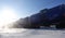 Freight train with oil tanks in motion. Snow dust flies from a passing train at high speed. Frosty sunny day. Winter. Russia