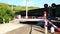 Freight train passes by a closed railway crossing