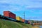 Freight train, transportation of railway cars by cargo containers shipping. Railway logistics concept