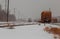 freight train travels through the vast expanses of snow-covered