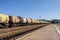 Freight trains.Railroad train of tanker cars transporting crude oil on the tracks