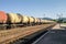 Freight trains.Railroad train of tanker cars transporting crude oil on the tracks
