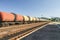 Freight trains.Railroad train of tanker cars transporting crude oil on the tracks