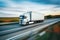 freight transportation, white cargo truck on the road. motion blur