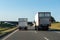 Freight trucks on a highway.