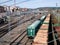 Freight wagons full of wood and other empty ones standing in rows on the parking tracks of the Monforte de Lemos station