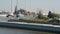 Freighter passing along a dock in the harbor of Ghent